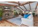 Living room featuring a stone fireplace, exposed beams, and hardwood floors at 4230 N Elizabeth Se Ln, Atlanta, GA 30339