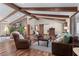 Inviting living area with exposed beams, fireplace, and comfortable seating at 4230 N Elizabeth Se Ln, Atlanta, GA 30339