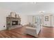 Cozy living room featuring a stone fireplace, couch, and large windows at 4230 N Elizabeth Se Ln, Atlanta, GA 30339