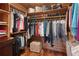 Well-organized walk-in closet with wood shelves and ample storage space for clothes and accessories at 4230 N Elizabeth Se Ln, Atlanta, GA 30339