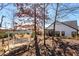 A beautiful backyard featuring a patio swing surrounded by mature trees at 515 Windy Ridge Ct, Canton, GA 30114