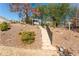 Landscaped backyard featuring a stone staircase leading to a charming white swing at 515 Windy Ridge Ct, Canton, GA 30114