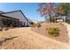 Manicured backyard with a stone staircase and a comfortable swing to relax in at 515 Windy Ridge Ct, Canton, GA 30114