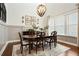 Dining room with large windows and elegant light fixture at 515 Windy Ridge Ct, Canton, GA 30114