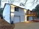 House showing a rear view with a garage and wooden porch at 5729 Rock Rd, Union City, GA 30291