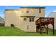 View of the back of the home that features a deck and green lawn at 8542 Lakemeadow Dr, Union City, GA 30291