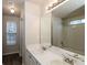 Well-lit bathroom with double sinks and a large mirror at 8542 Lakemeadow Dr, Union City, GA 30291