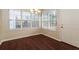 Bright dining room with a chandelier and multiple windows for ample natural light at 8542 Lakemeadow Dr, Union City, GA 30291