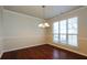 Formal dining room with chair rail, light fixture, and large window at 8542 Lakemeadow Dr, Union City, GA 30291