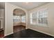 View of dining room featuring dark floors, a light fixture, and plenty of natural light at 8542 Lakemeadow Dr, Union City, GA 30291