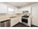 Cozy kitchen featuring stainless steel appliances and ample countertop space at 8542 Lakemeadow Dr, Union City, GA 30291