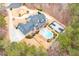 Aerial view of a sprawling estate with pool, basketball court, surrounded by lush greenery at 3201 Hobsons Ridge Nw Trl, Acworth, GA 30101