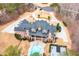 Stunning aerial view of estate with pool, basketball court, circular driveway, and beautiful landscaping at 3201 Hobsons Ridge Nw Trl, Acworth, GA 30101