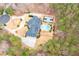 Aerial view of a beautiful estate featuring a large home, pool, tennis court, circular driveway, and lush landscaping at 3201 Hobsons Ridge Nw Trl, Acworth, GA 30101