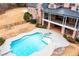 Aerial view showcasing a large backyard with a pool, patio, landscaped grounds, and a beautiful two-story home at 3201 Hobsons Ridge Nw Trl, Acworth, GA 30101