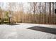 An outdoor basketball court with lush treeline backdrop at 3201 Hobsons Ridge Nw Trl, Acworth, GA 30101