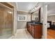 Bright bathroom with glass shower and double sink vanity with granite countertop at 3201 Hobsons Ridge Nw Trl, Acworth, GA 30101