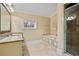 Bright bathroom features a soaking tub, granite counters, and glass shower at 3201 Hobsons Ridge Nw Trl, Acworth, GA 30101
