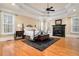 Spacious bedroom featuring a fireplace, trey ceiling, and hardwood floors at 3201 Hobsons Ridge Nw Trl, Acworth, GA 30101