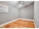 A simple room featuring hardwood floors, soft gray walls, a window, and pot lights at 3201 Hobsons Ridge Nw Trl, Acworth, GA 30101