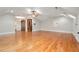 Expansive bonus room featuring hardwood floors, vaulted ceilings, and a charming ceiling fan at 3201 Hobsons Ridge Nw Trl, Acworth, GA 30101
