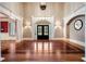 Elegant foyer featuring hardwood floors, a decorative archway and sidelight windows flanking front door at 3201 Hobsons Ridge Nw Trl, Acworth, GA 30101