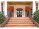 Inviting entryway features brick steps, iron railings, and an elegant glass-paneled front door at 3201 Hobsons Ridge Nw Trl, Acworth, GA 30101