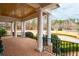 Spacious front porch with brick flooring and stately columns at 3201 Hobsons Ridge Nw Trl, Acworth, GA 30101