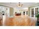 Open concept, large great room with wood floors leads to kitchen and outdoor spaces at 3201 Hobsons Ridge Nw Trl, Acworth, GA 30101