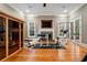 Spacious home gym featuring a fireplace, wall-mounted TV, hardwood floors, and sauna, perfect for fitness enthusiasts at 3201 Hobsons Ridge Nw Trl, Acworth, GA 30101