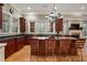 Modern kitchen featuring a granite island with seating and stainless steel appliances with hardwood floors at 3201 Hobsons Ridge Nw Trl, Acworth, GA 30101