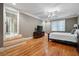 Spacious main bedroom with hardwood floors, tray ceilings, and a large walk-in closet at 3201 Hobsons Ridge Nw Trl, Acworth, GA 30101