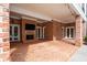 Spacious brick patio featuring a fireplace, multiple doorways, and ample seating area perfect for entertaining at 3201 Hobsons Ridge Nw Trl, Acworth, GA 30101