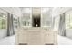 Large bathroom with marble counters, double sinks, and natural light at 4000 Conway Valley Nw Rd, Atlanta, GA 30327