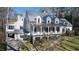Charming home features covered front porch, stone accents, and mature landscaping at 4000 Conway Valley Nw Rd, Atlanta, GA 30327