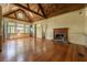 Open living room featuring beautiful hardwood floors and a classic fireplace at 4000 Conway Valley Nw Rd, Atlanta, GA 30327