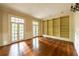 Light and airy living room with hardwood floors and double doors leading to the outside at 4000 Conway Valley Nw Rd, Atlanta, GA 30327