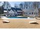 An in-ground pool sits in the backyard with ample lawn and outdoor recreation space at 4000 Conway Valley Nw Rd, Atlanta, GA 30327