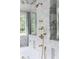 Luxurious marble shower featuring elegant gold fixtures and a spacious design at 4000 Conway Valley Nw Rd, Atlanta, GA 30327