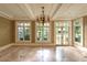 A sunroom with large windows, tiled floor, and natural light at 4000 Conway Valley Nw Rd, Atlanta, GA 30327
