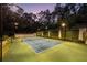 A well-lit tennis court with manicured greenery provides a perfect recreational amenity at 4000 Conway Valley Nw Rd, Atlanta, GA 30327