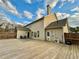 Backyard view featuring a large deck area and neutral siding at 4188 Gunnerson Ln, Kennesaw, GA 30152