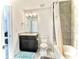 Cozy bathroom with dark wood cabinets and tub/shower with gray tile at 4188 Gunnerson Ln, Kennesaw, GA 30152
