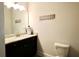 Modern half-bathroom featuring dark cabinets and a marble countertop at 4188 Gunnerson Ln, Kennesaw, GA 30152