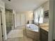 Large bathroom with a soaking tub, shower, and lots of natural light at 4188 Gunnerson Ln, Kennesaw, GA 30152