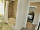 Bright bathroom adjacent to bedroom featuring shower and light tile floor at 4188 Gunnerson Ln, Kennesaw, GA 30152