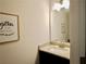 Cozy bathroom features a decorative mirror, and a sink with granite countertop at 4188 Gunnerson Ln, Kennesaw, GA 30152
