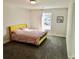 Bedroom featuring a yellow bedframe with an adjacent bright window at 4188 Gunnerson Ln, Kennesaw, GA 30152