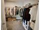 Walk-in closet featuring ample storage with shelves and hanging rods at 4188 Gunnerson Ln, Kennesaw, GA 30152