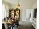 Bright dining area with carpet, neutral walls, stylish lighting, and open access to the hallway at 4188 Gunnerson Ln, Kennesaw, GA 30152